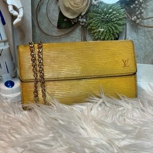 Authentic Louis Vuitton Epi Sarah yellow wallet with Purple interior